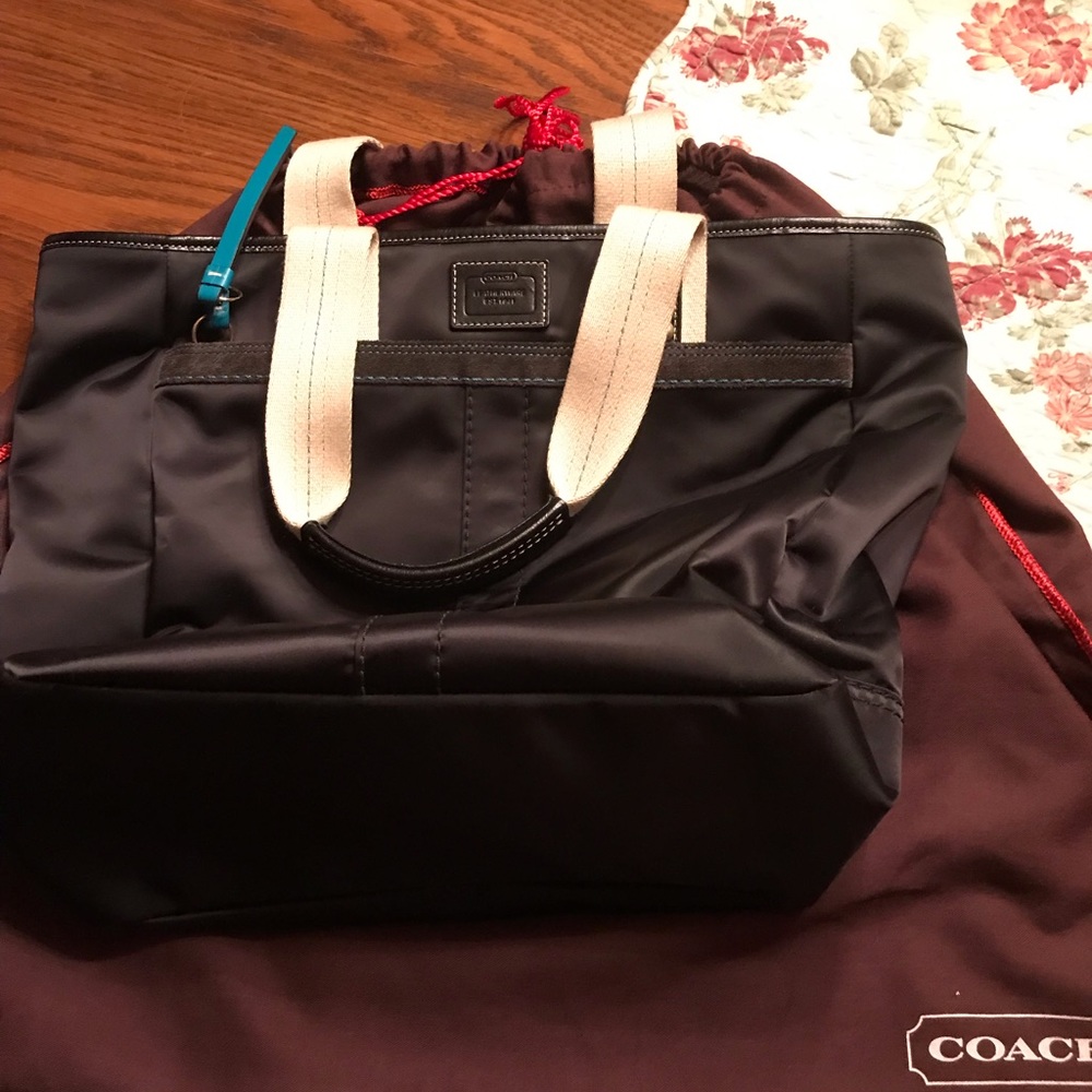 Fun and stylish Coach Black satin tote.